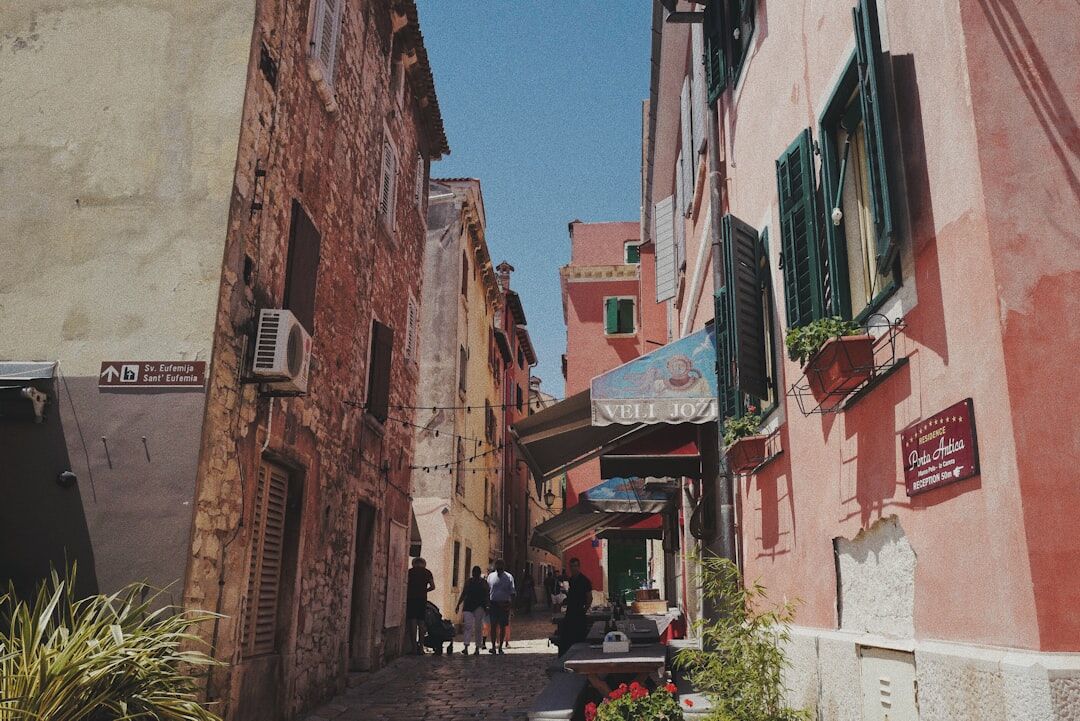 Narrow stone alley in Rovinj with laundry lines