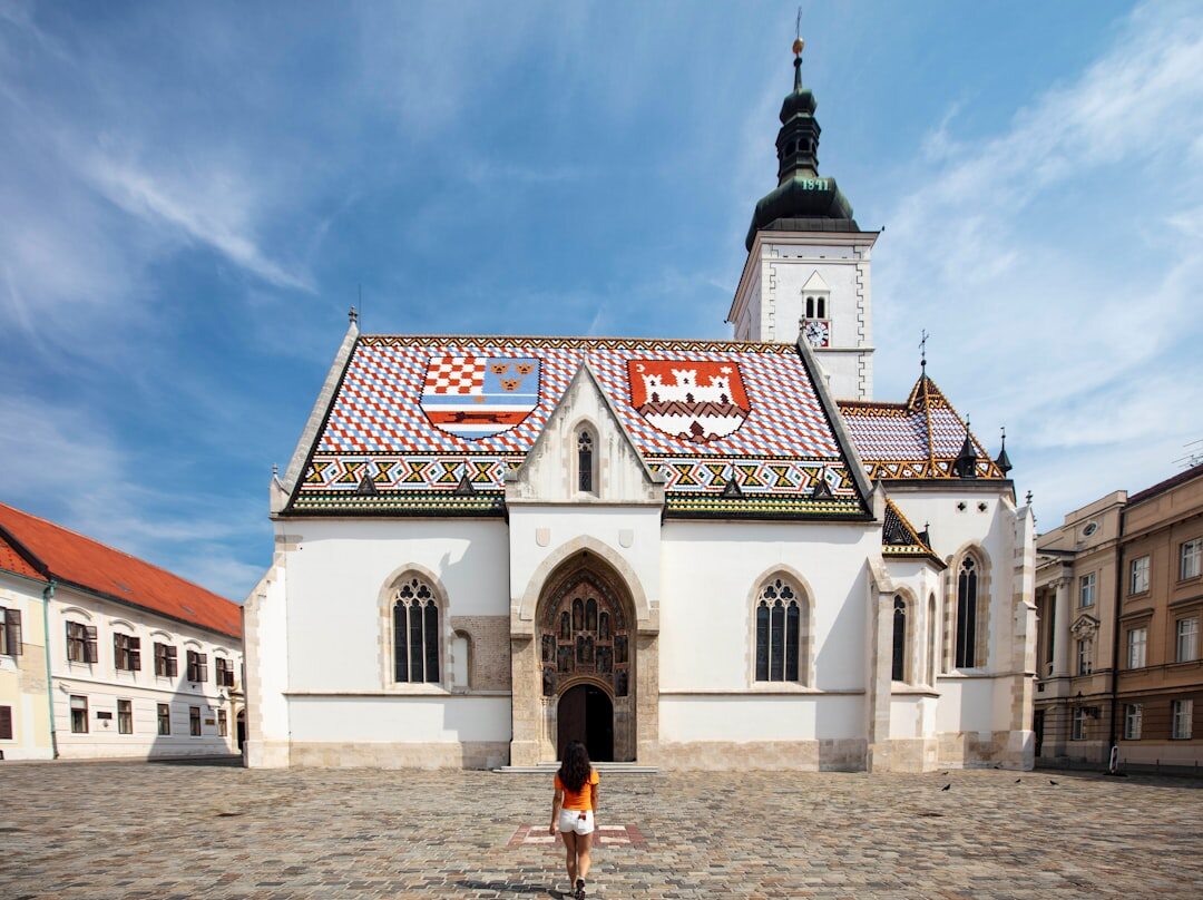 Children playing football in a small Dalmatian square