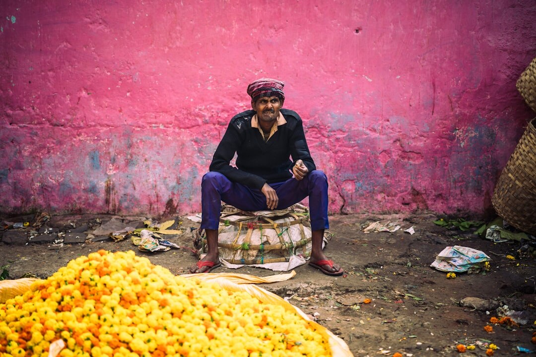 Elderly woman selling flowers at a Split market stall