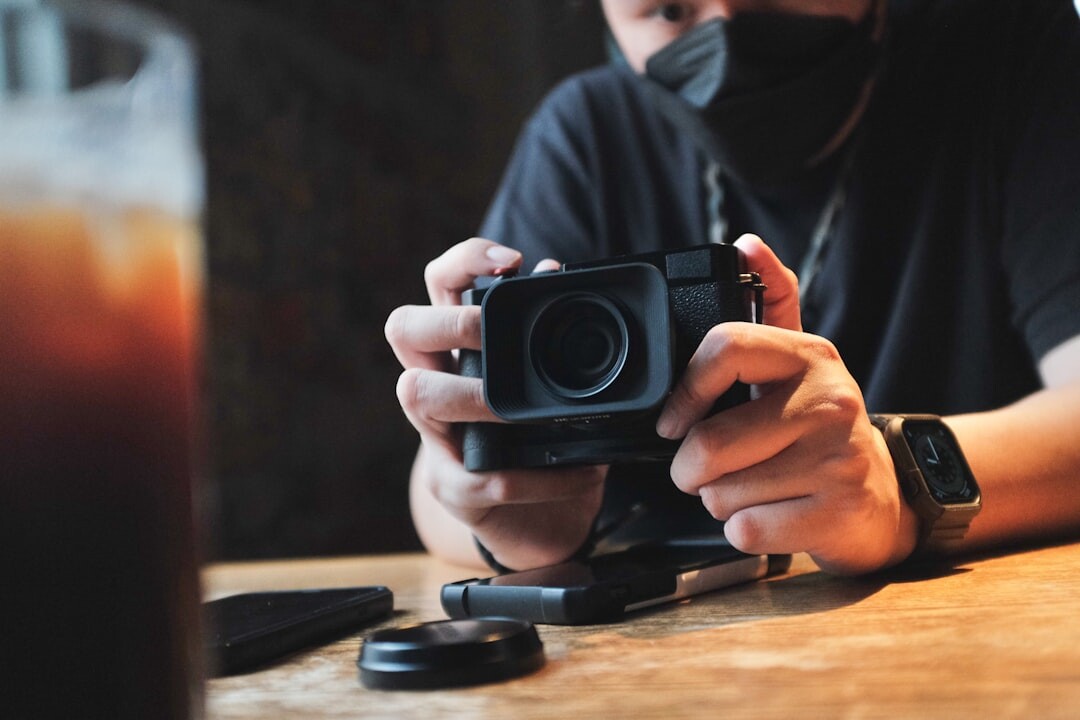 Photographer setting up equipment inside a modern restaurant interior