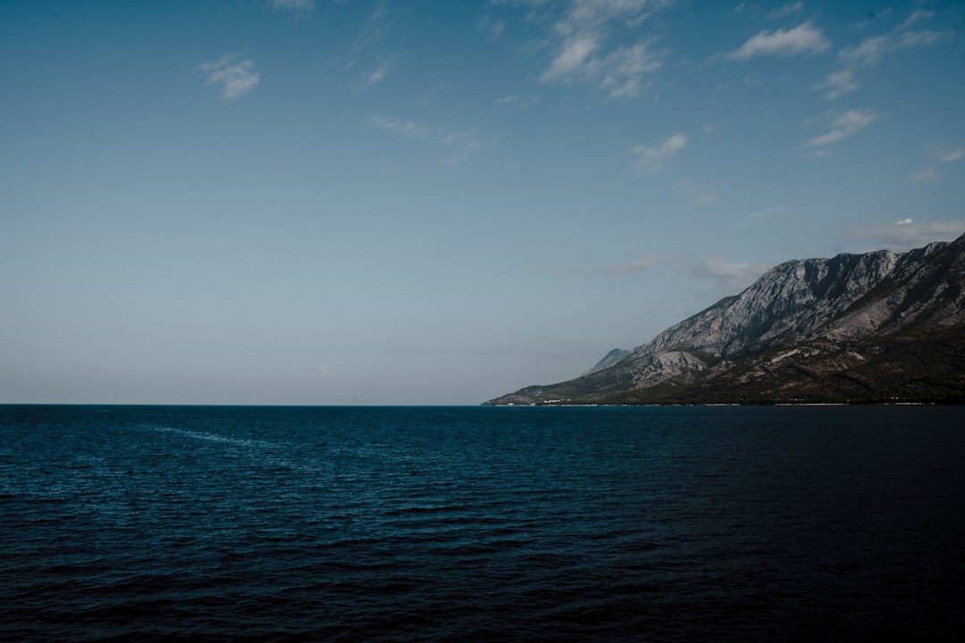 Karst cliffs above the turquoise Adriatic Sea