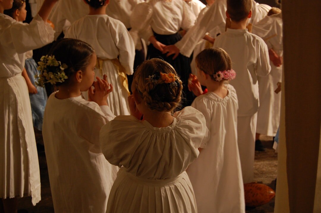 Croatian folk dancer mid-motion in traditional embroidered dress