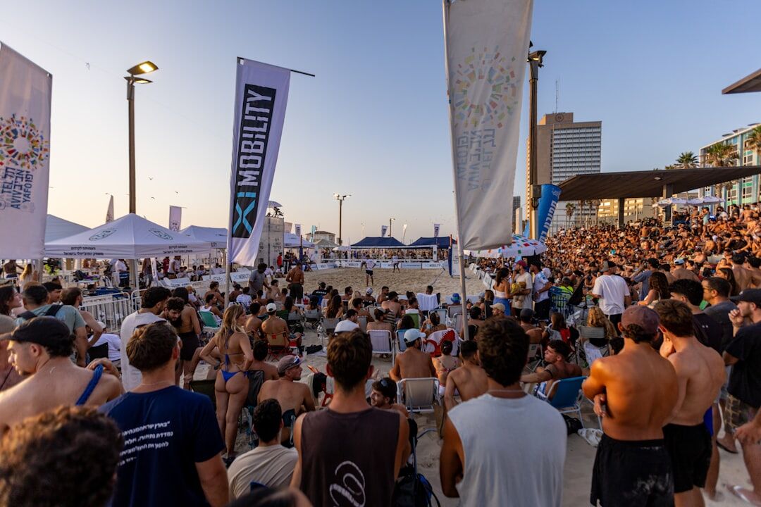 Crowd enjoying an open-air summer concert on the coast